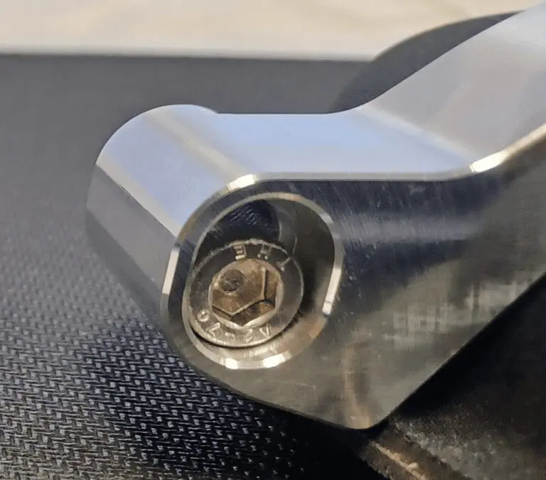 Metallic component with a hexagonal bolt.